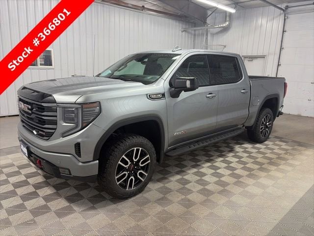 2026 GMC Sierra 1500 AT4 in Sterling Metallic — front three-quarter view