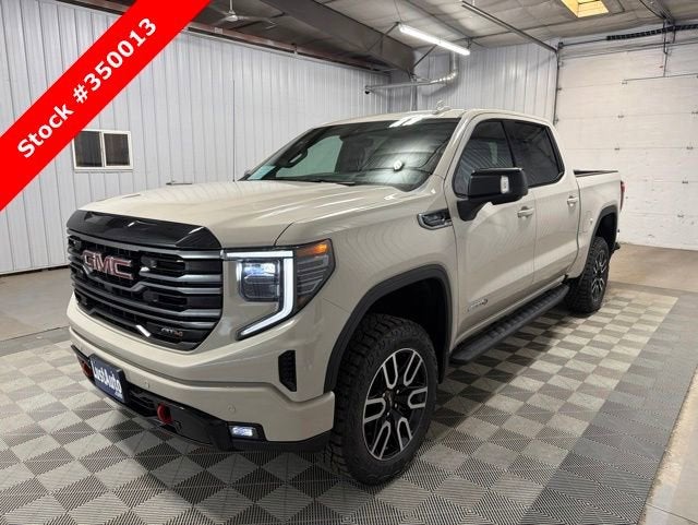 2026 GMC Sierra 1500 AT4 in Coastal Dune — front three-quarter view